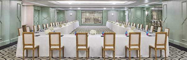 Chairs set up in horseshoe configuration in meeting room