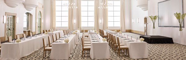 Chairs set up in a conference style in the ballroom at The Maybourne Beverly Hills