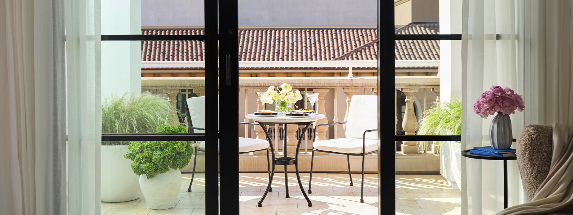 Table and two chairs on terrace of suite